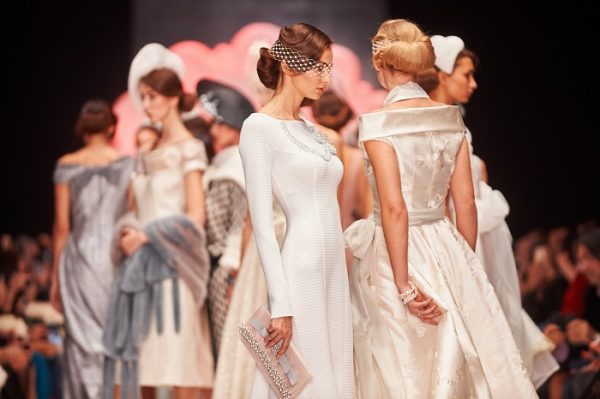 group of models walking the runway fashion show