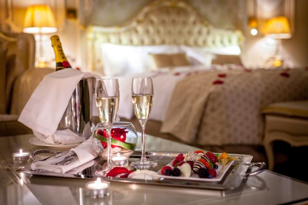 Elegant woman in a restaurant setting — luxury travel date experience