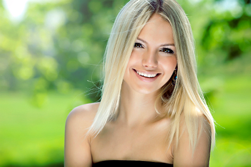 a beautiful young girl smiles