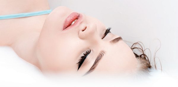 woman with pink lipstick, studio beauty shot