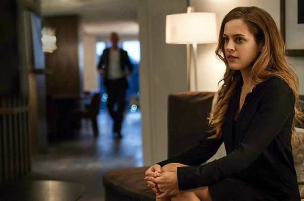 elegant man and younger woman meeting in luxury hotel lobby