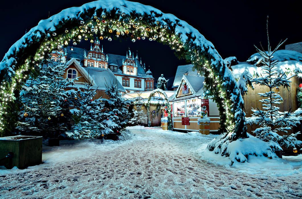 illuminated winter arch tunnel at night decorated with Christmas lights