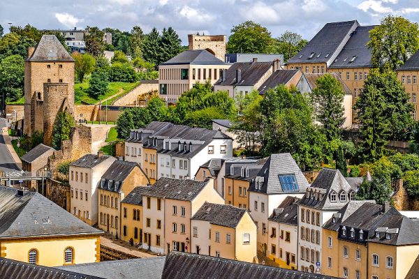 Elegant cityscape with a refined woman enjoying Luxembourg — ideal for luxury travel companion moments