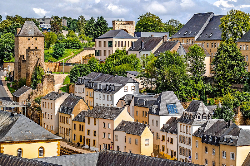 Elegant cityscape with a refined woman enjoying Luxembourg — ideal for luxury travel companion moments